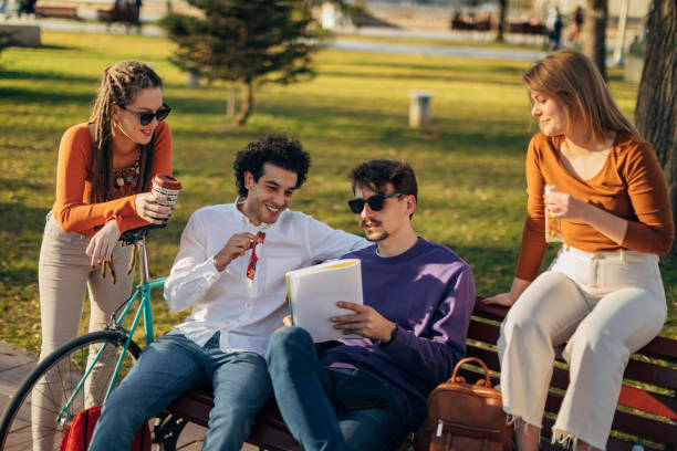 istock A group of students spends a sunny day in the park solving homework together 1417564631