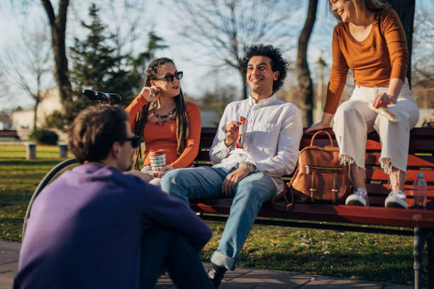 istock A small group of students enjoy a weekend in the park 1417564738