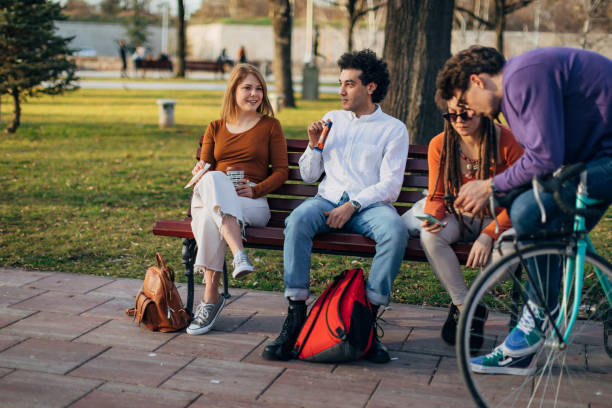 istock A group of students rests in the park after studying 1417565002