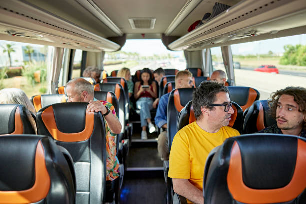 istock Diverse group of passengers traveling on deluxe motor coach 1417565231
