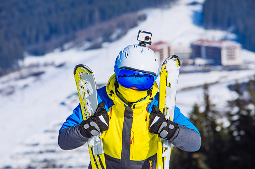 woman in ski equipment on the top of the hill. lifestyle