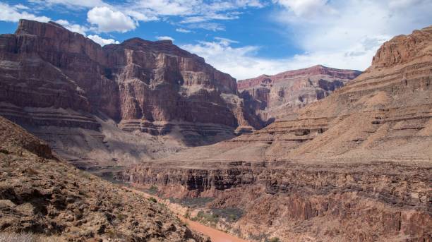 istock Canyon during daylight with blue cloudy sky above 1417571712