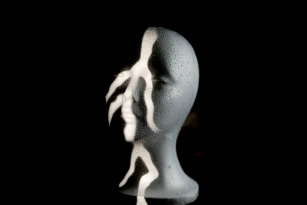 istock Closeup of a bust sculpture under creative lights against a black background 1417573281