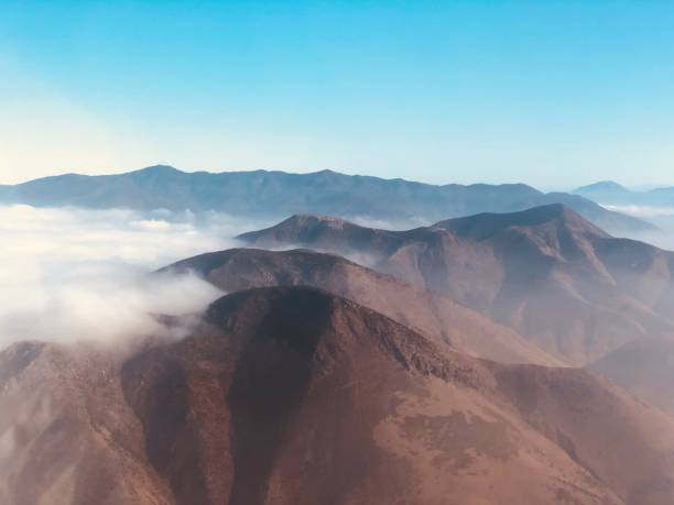istock Aerial view of mountains covered with clouds 1417573907
