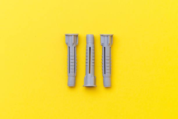 istock Three dowels are isolated on yellow background 1417574722