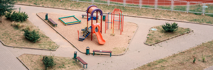 Panoramic large empty playground in city yard top view. Urban area for childrens sport and game entertainment.