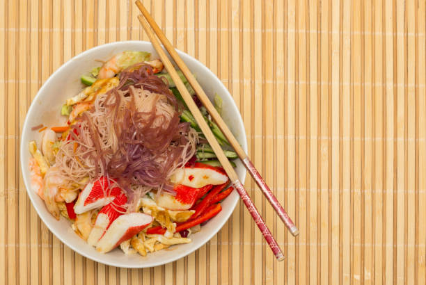 istock Asian noodle salad with vegetables and seafood 1417577327