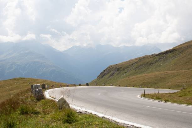 istock Long wavy asphalt road in the mountain fields in the countryside 1417578996