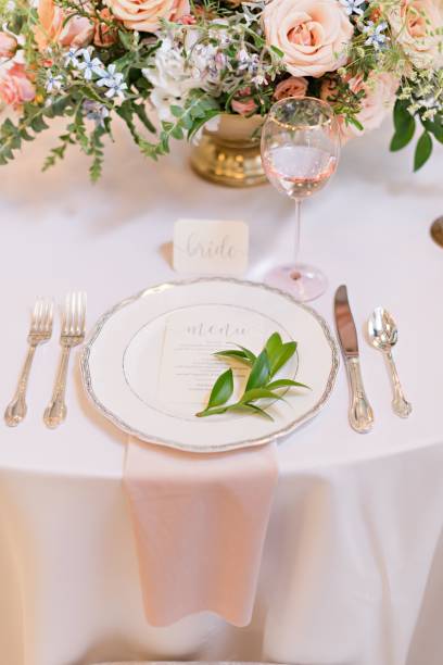istock Vertical closeup shot of a wedding-styled table reception with elegant settings 1417579675