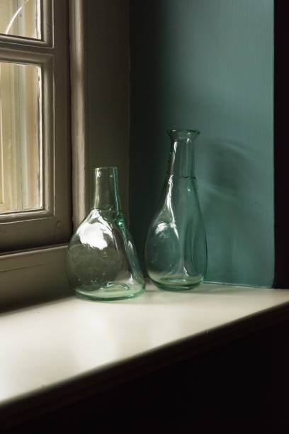 istock Vertical closeup shot of blue empty bottles on the windowsill 1417580192