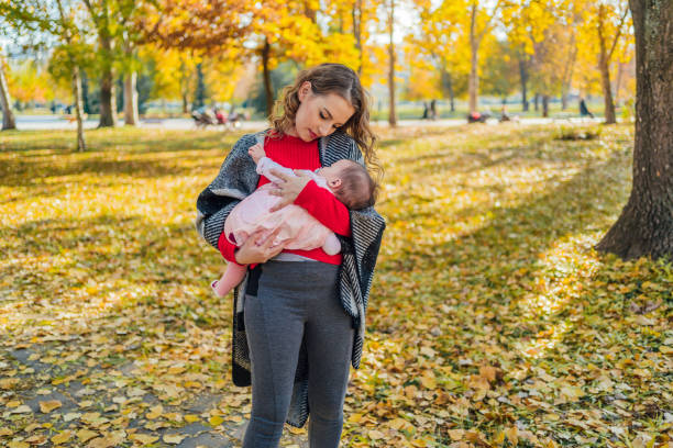 istock Mother with her baby in the park 1417584149