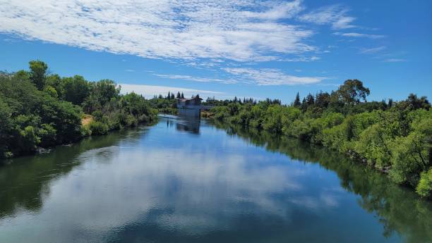 istock American River reflecting the blue cloudy sky 1417584359