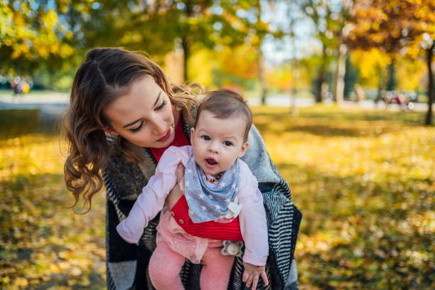 istock Mother with her baby in the park 1417586866