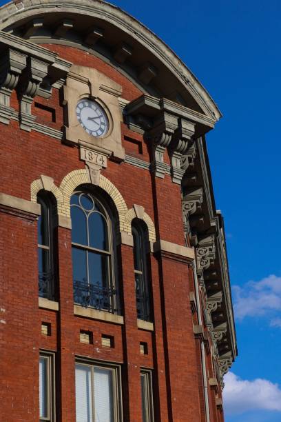 istock Vertical shot of a brick building with a clock 1417587434
