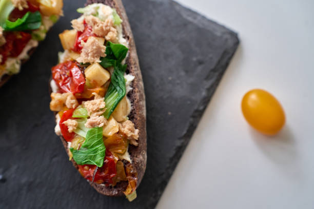 brunch toast: rye bread, topped with tuna, tomato, vegetables and cheese