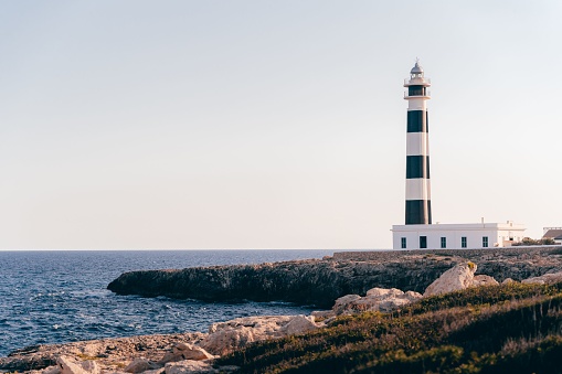 A beautiful shot of a lighthouse in Menorca, Spain during the day