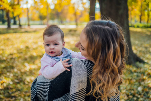 istock Mother with her baby in the park 1417588565