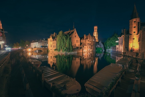Rozenhoedkaai Rosary Quay Quai of the Rosary in Bruges Belgium by Night. Belfry in the Background