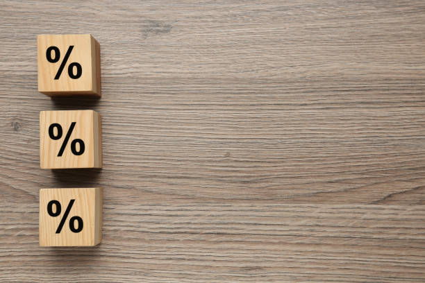 istock Wooden cubes with percent signs on table, flat lay. Space for text 1417592234