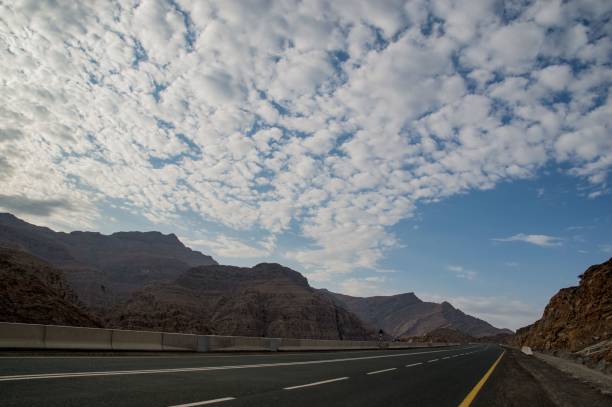 istock Empty asphalt road to Jebel Jais passing through a mountainous landscape on a sunny day in UAE 1417592964