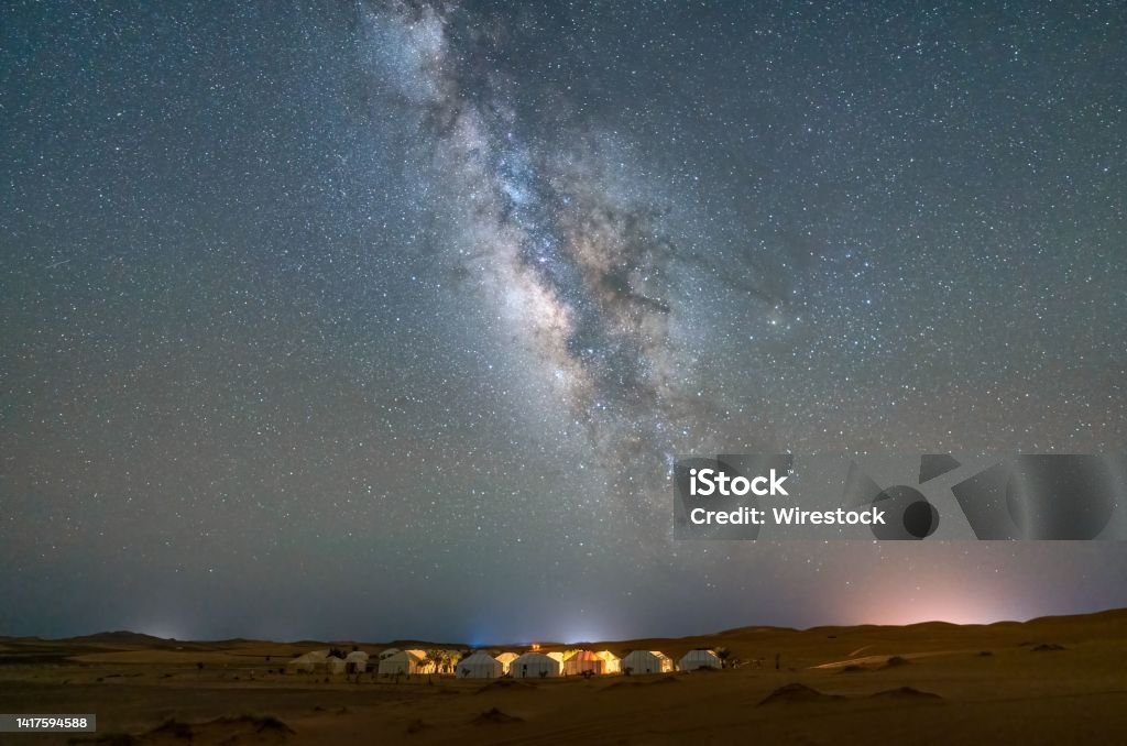 Aerial view of cityscape of Merzouga under Milky Way in the sky in Sahara desert An aerial view of cityscape of Merzouga under Milky Way in the sky in Sahara desert Merzouga Stock Photo
