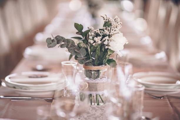 istock Closeup shot of a wedding table decoration with simple small bouquet 1417594861