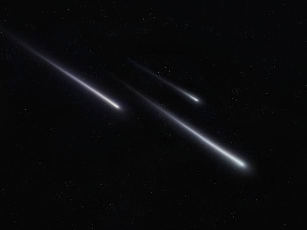 istock Three meteors in the night sky with stars. Shooting stars. 1417597719