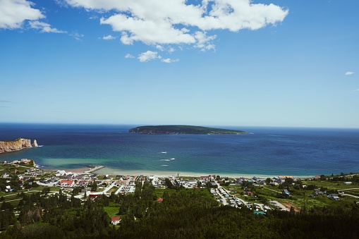 A beautful beach scenery with houses against azure sea on a sunny day