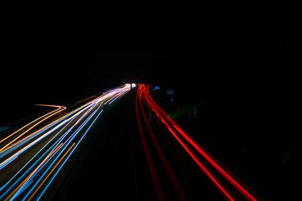 istock Cars light trails in the darkness. 1417597886