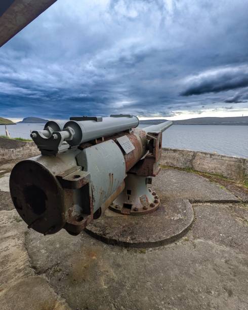 istock Vertical shot of a cannon from World War 2 under a cloudscape on Faroe Islands, Denmark 1417598251