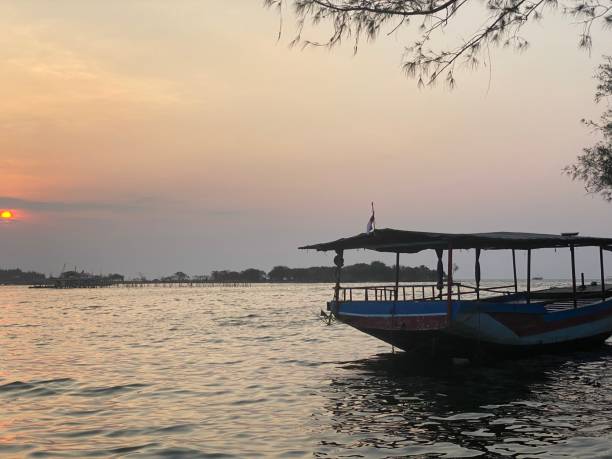 istock Boat on the beach with sunset 1417598823