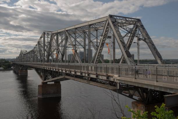 istock Alexandra Bridge in Canada with gray clouds above spanning the Ottawa River 1417599693