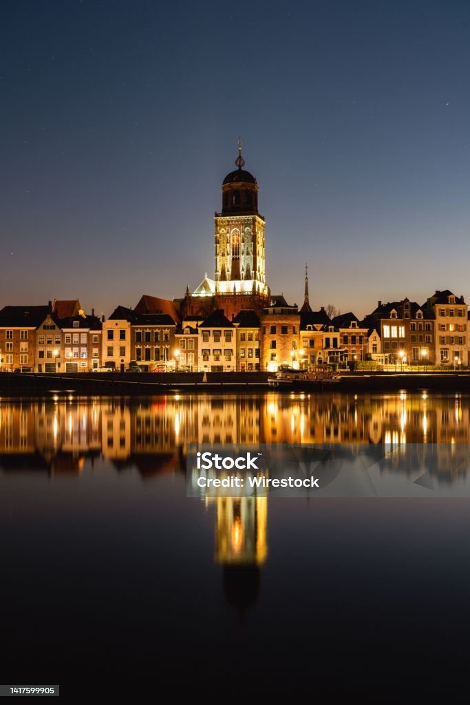 Vertical shot of the St Lebuinus Church in Deventer, Netherlands at night A vertical shot of the St Lebuinus Church in Deventer, Netherlands at night Deventer Stock Photo