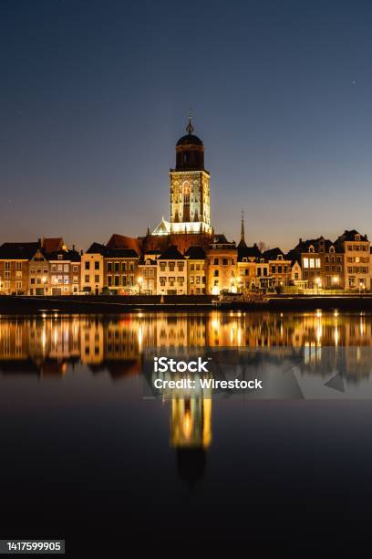 Vertical Shot Of The St Lebuinus Church In Deventer Netherlands At Night Stock Photo - Download Image Now