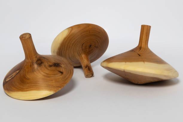 istock Wooden spinning top on a white table 1417601433