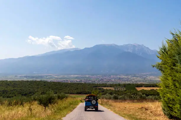 Road to Mount Olympus with panoramic view of mountains, valleys and fields, Greece