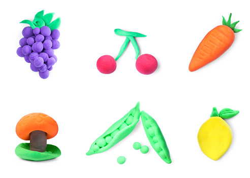 Fruits and vegetables made from playdough on white background, collage