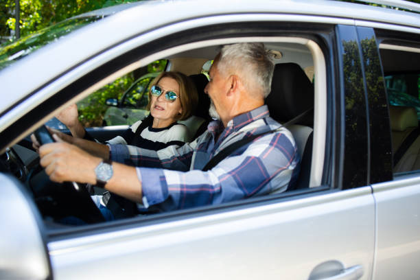 istock Senior couple going on a journey by a car 1417608828