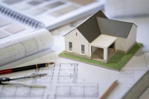 istock Architect Design Concept, House model on Buleprint construction drawing and drawing equipment stationary 1417609377