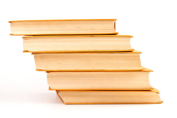 istock Stack of old books on light background. Book pile. 1417609922