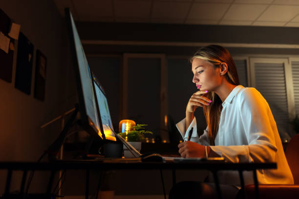 Female Video and Sound Editor Working Late