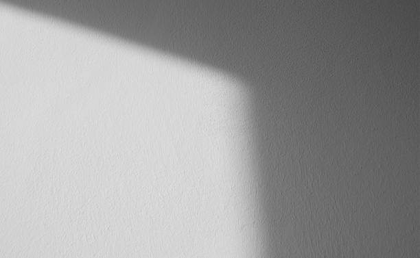 istock Abstract pattern of shadows by sunny beams on a wall as  texture or background 1417612336