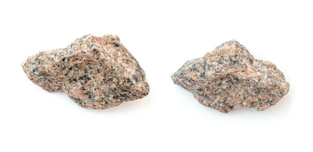 istock Two pieces of broken granite stones isolated on white 1417612342
