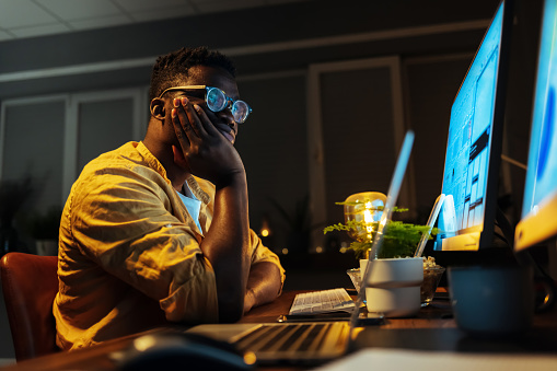 Bored Male Programmer Working On Pc In The Office Stock Photo ...