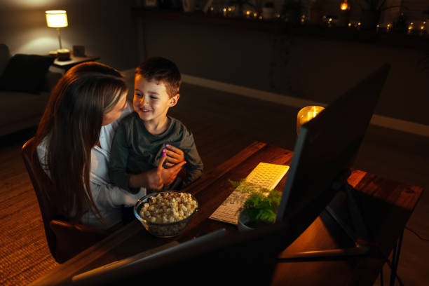 istock Happy mother talking to her son while working at home. 1417613355