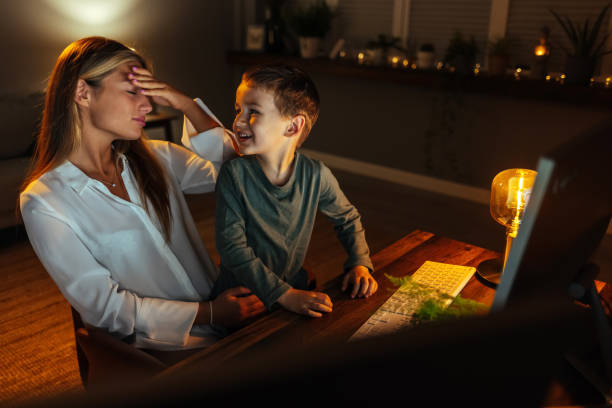 istock Freelancer mom working at home during lockdown, noisy child distracts asking attention. 1417614569