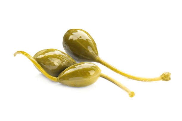 istock Three delicious pickled capers on white background 1417615682