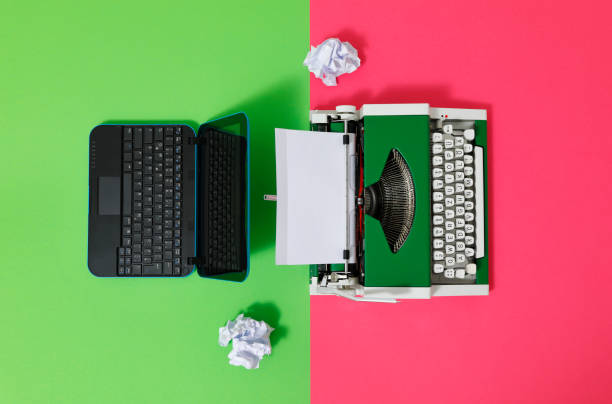 istock Digital und analog – Laptop and 70s Typewriter 1417616022