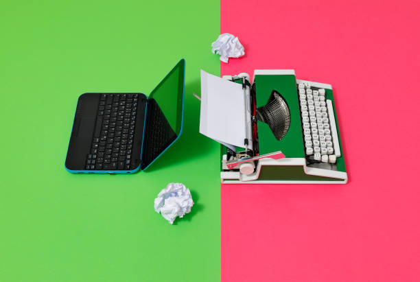 istock Digital und analog – Laptop and 70s Typewriter 1417616031