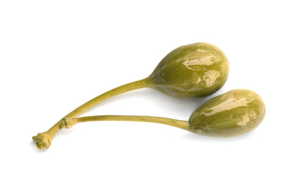 istock Two delicious pickled capers on white background, top view 1417616266